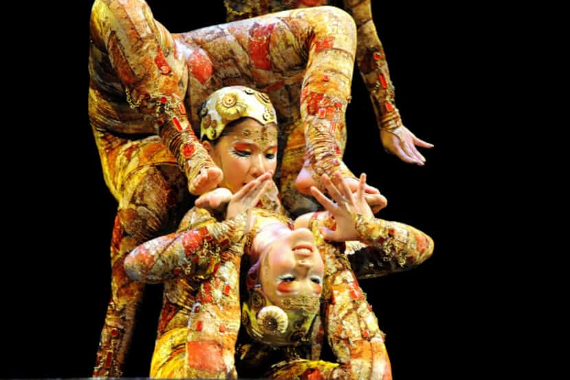 Contortionists perform on the opening night of Cirque du Soleil's "Kooza" on Wednesday,...