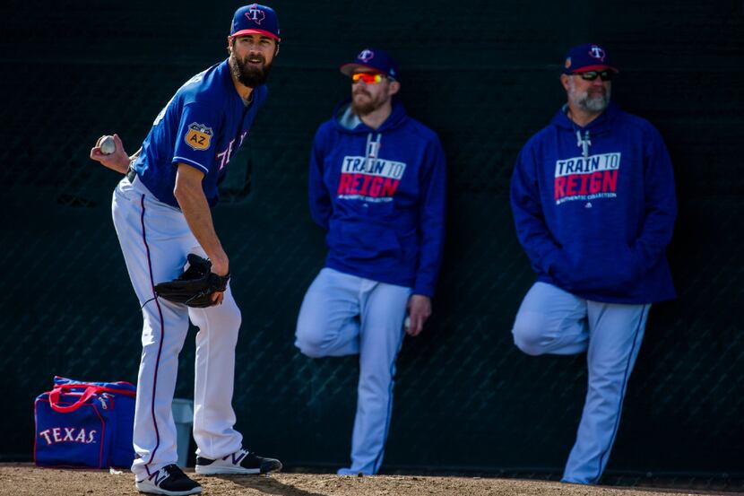 Texas Rangers starting pitcher Cole Hamels (35) prepares to pitch in the bullpen in front of...