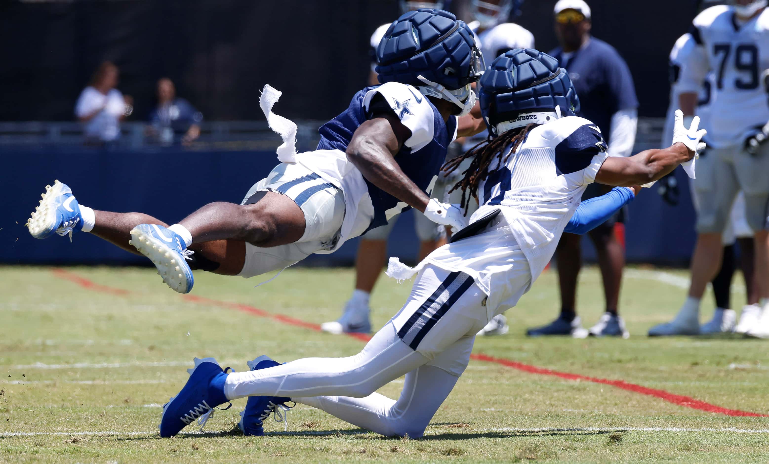 Dallas Cowboys cornerback Jourdan Lewis (2, top) lays out to deflect a pass intended for...