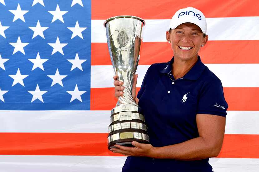 Angela Stanford of the United States poses with the trophy after victory in the Evian...