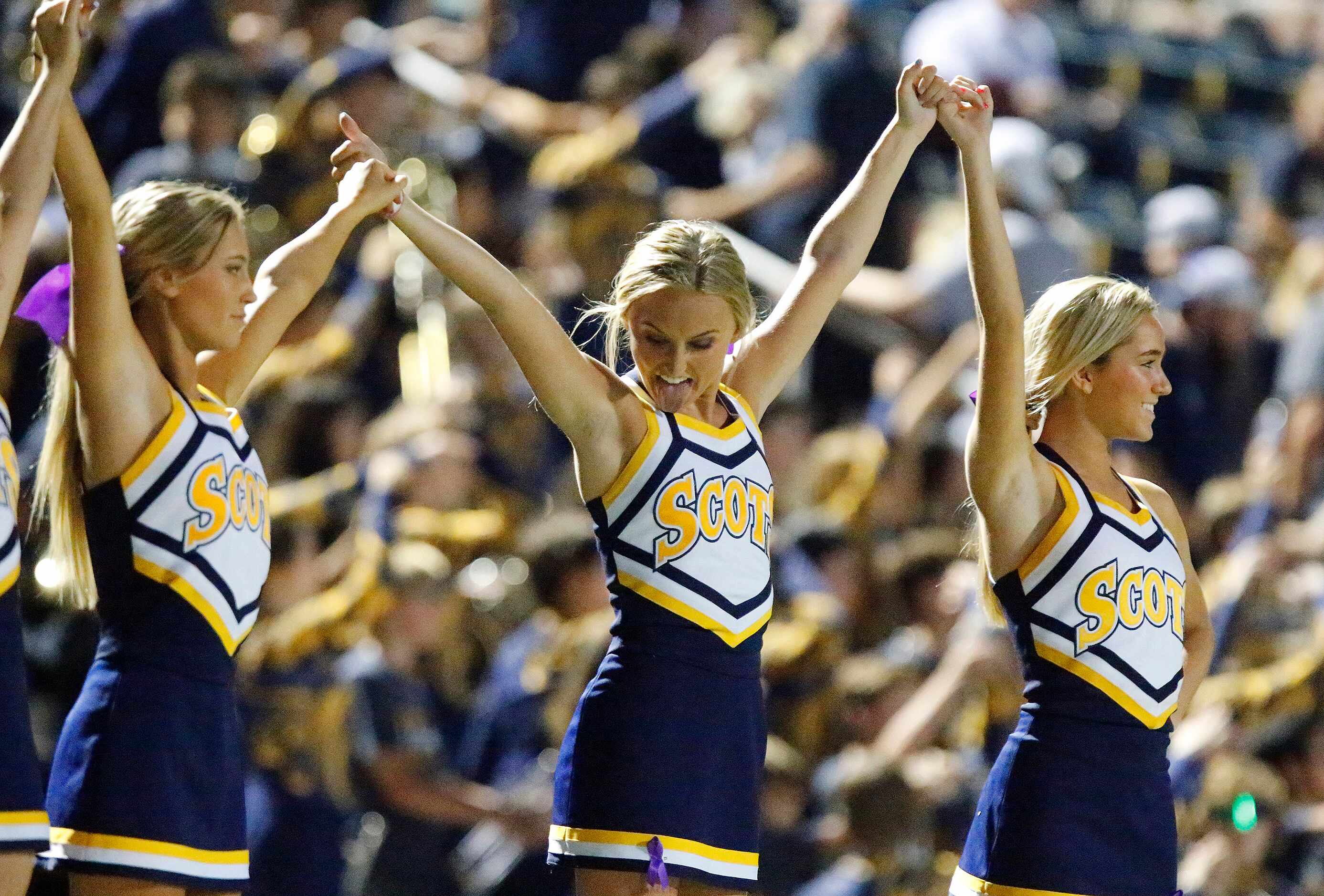 Highland Park cheerleaders Lucy Needleman (center), 17, gets ready for kickoff  as Highland...