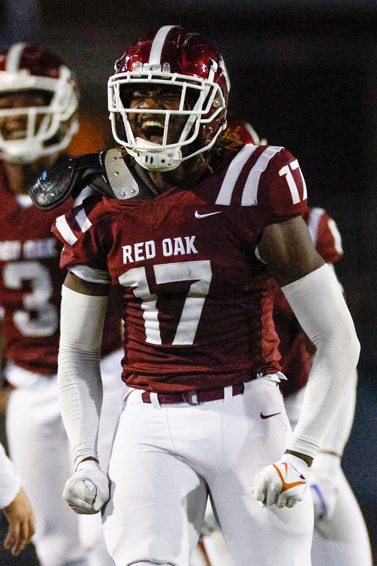 Red Oak defensive lineman Jordan Omolola (17) celebrates after a turnover on downs during...