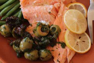 
Lemony roasted salmon gets a topping made with prunes and olives. 



