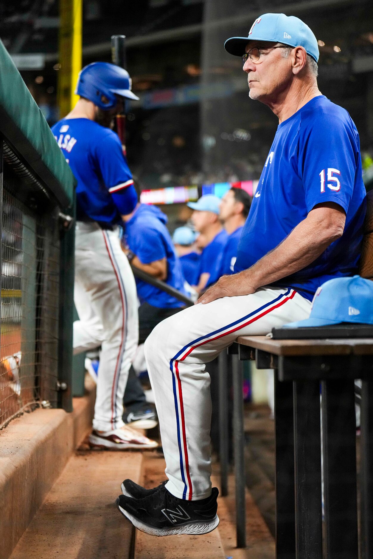 Texas Rangers manager Bruce Bochy looks on from the dugout during the fourth inning of an...