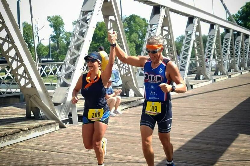 Chelsea Neal crossing the finish line  of Tri Waco with her dad, Darrel, in July 2018....