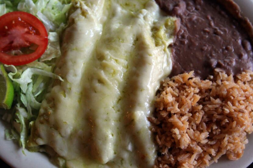 At Cuquita's Restaurant in Dallas, chicken enchiladas Mexicanas are made with fresh...