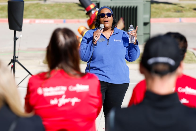 Nicole S. Bursey, Executive Director of Frisco Family Services, speaks towards a group of...