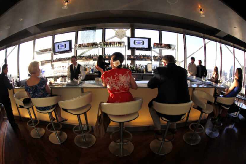 The bar in the slowly rotating dining room with spectacular views mixes some of the most...