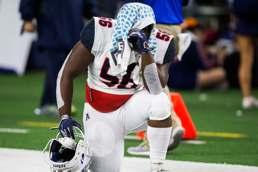 Allen defensive lineman Kenatah Carter (56) reacts to a 60-59 loss to Rockwall in a Class 6A...