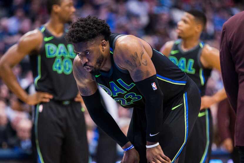 Dallas Mavericks guard Wesley Matthews (23) reacts to hitting the ground after being fouled...