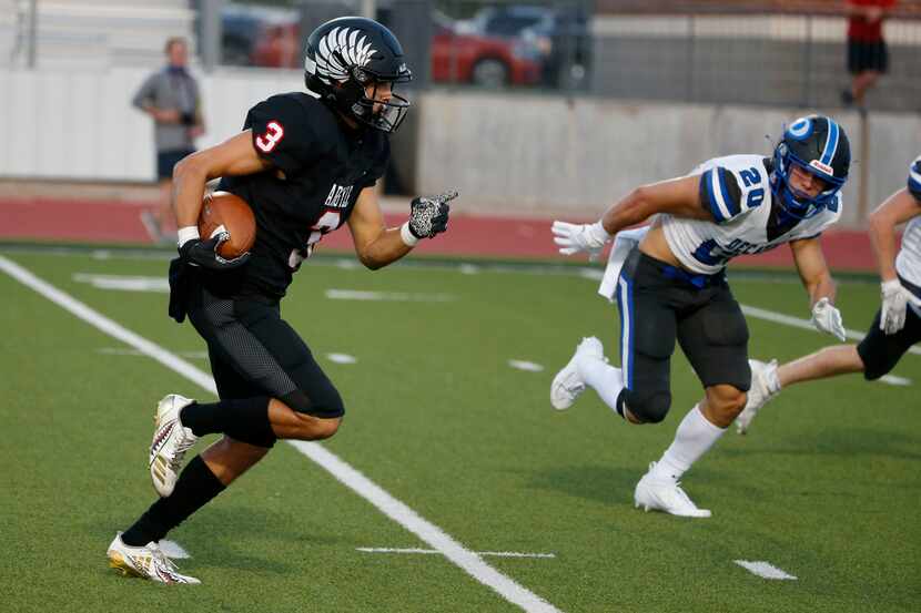 Argyle receiver Cash Walker (3) scores a touchdown as he is chased by Decatur's Jackson...