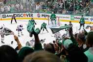 Fans cheer in the third period during Game 1 of the NHL hockey Stanley Cup Western...