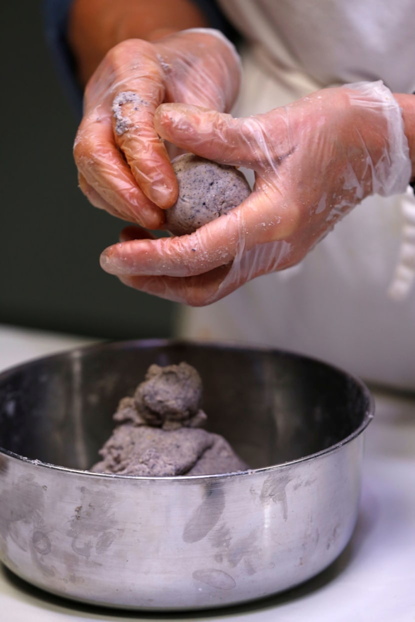 Dotty Griffith rolls up Blue Corn Tortillas 