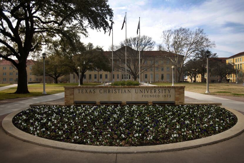 The Texas Christian University sign greets visitors and students to campus in front of M.E....