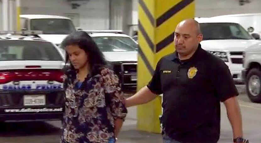 Sini Mathews, the mother of Sherin Mathews, is escorted by police during her transfer to...