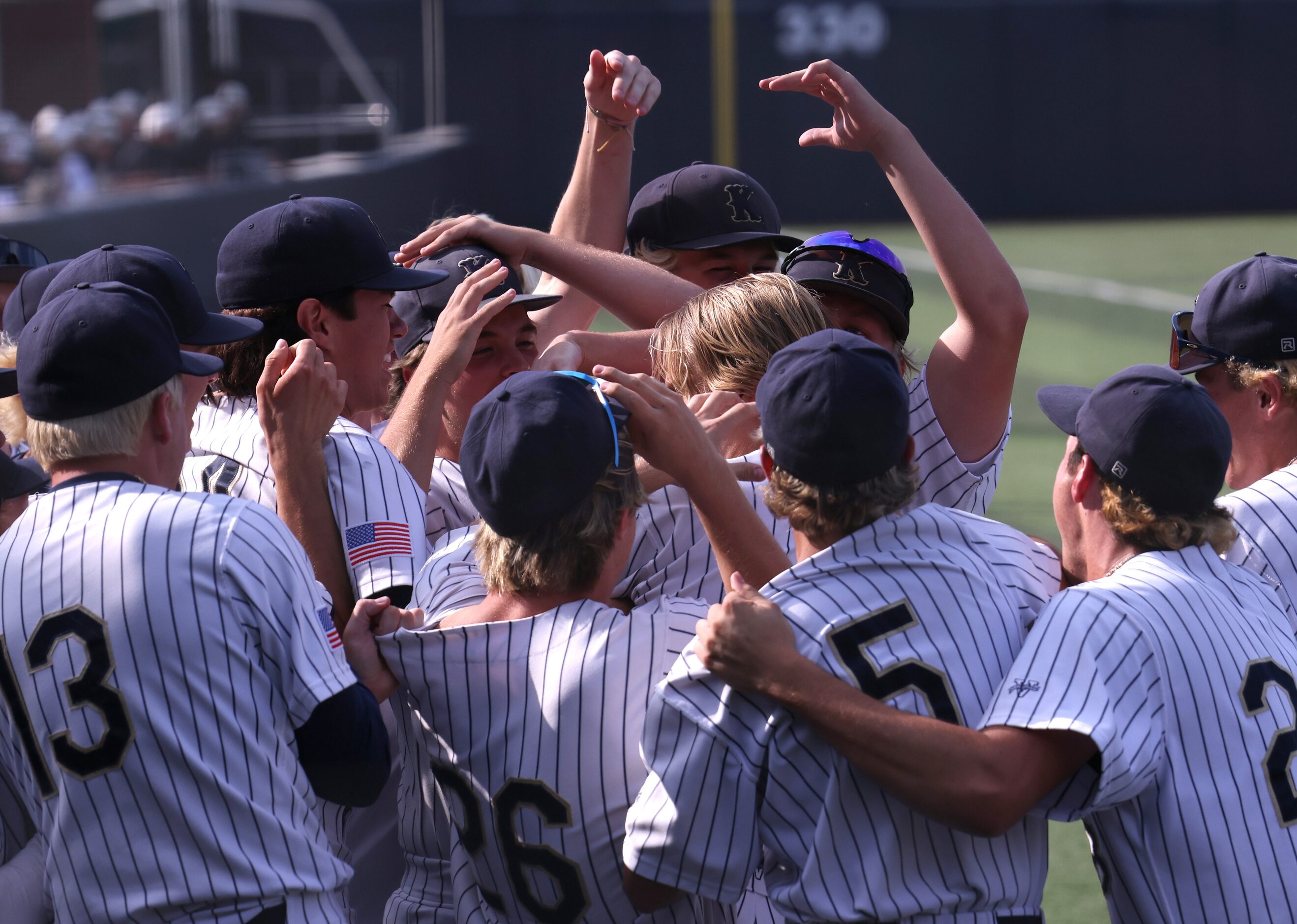 Keller designated hitter Drew Roberts (10), center, is mobbed by teammates after hitting a...