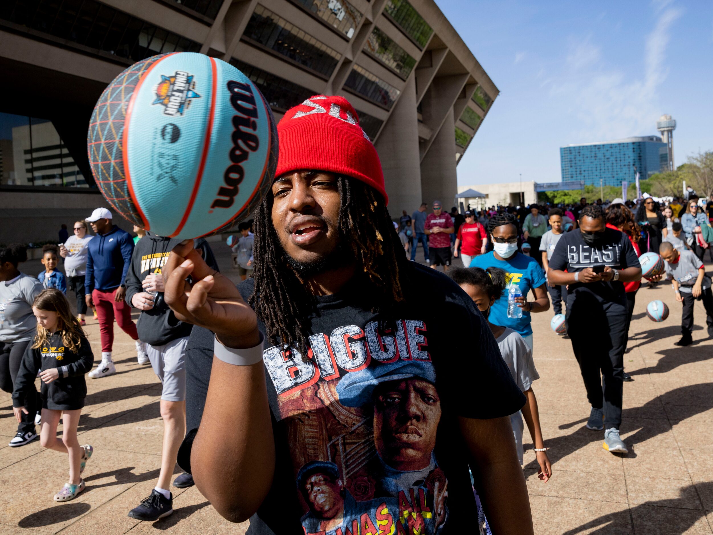 Latreyll Bell of Little Elm spins a basketball on his finger while making his way from City...