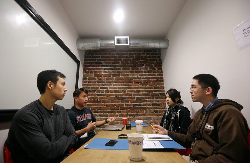 In this Saturday, Feb. 8, 2014 photo, participants Ian Wong, from left, Willy Chu, Yuriko...