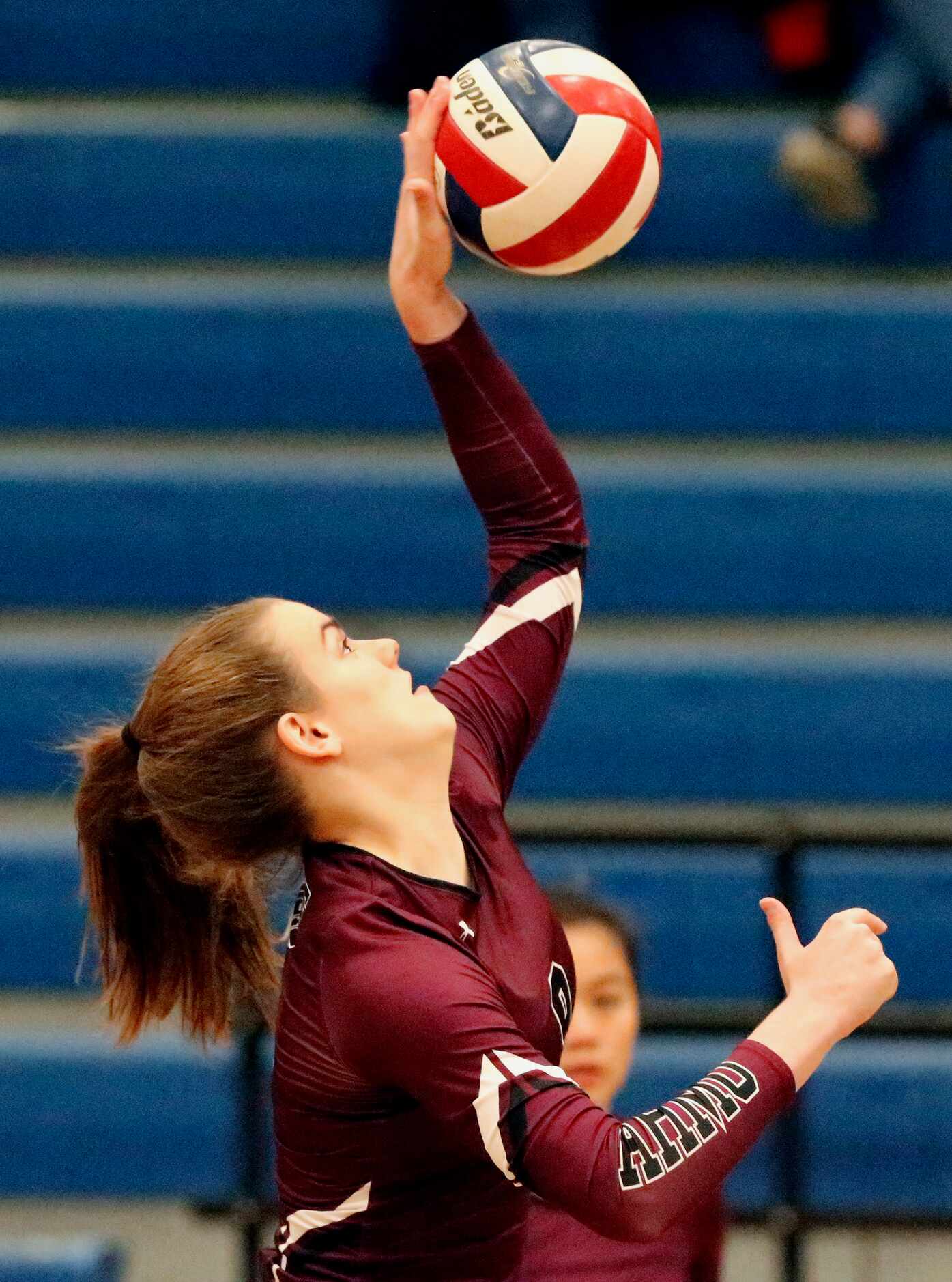 Wylie High School setter Anna Heath (9) makes a hit during game one as Sachse High School...