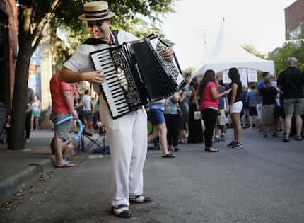 Matt Tolentino plays for pedestrians during the 6th Annual Bastille on Bishop Festival in...