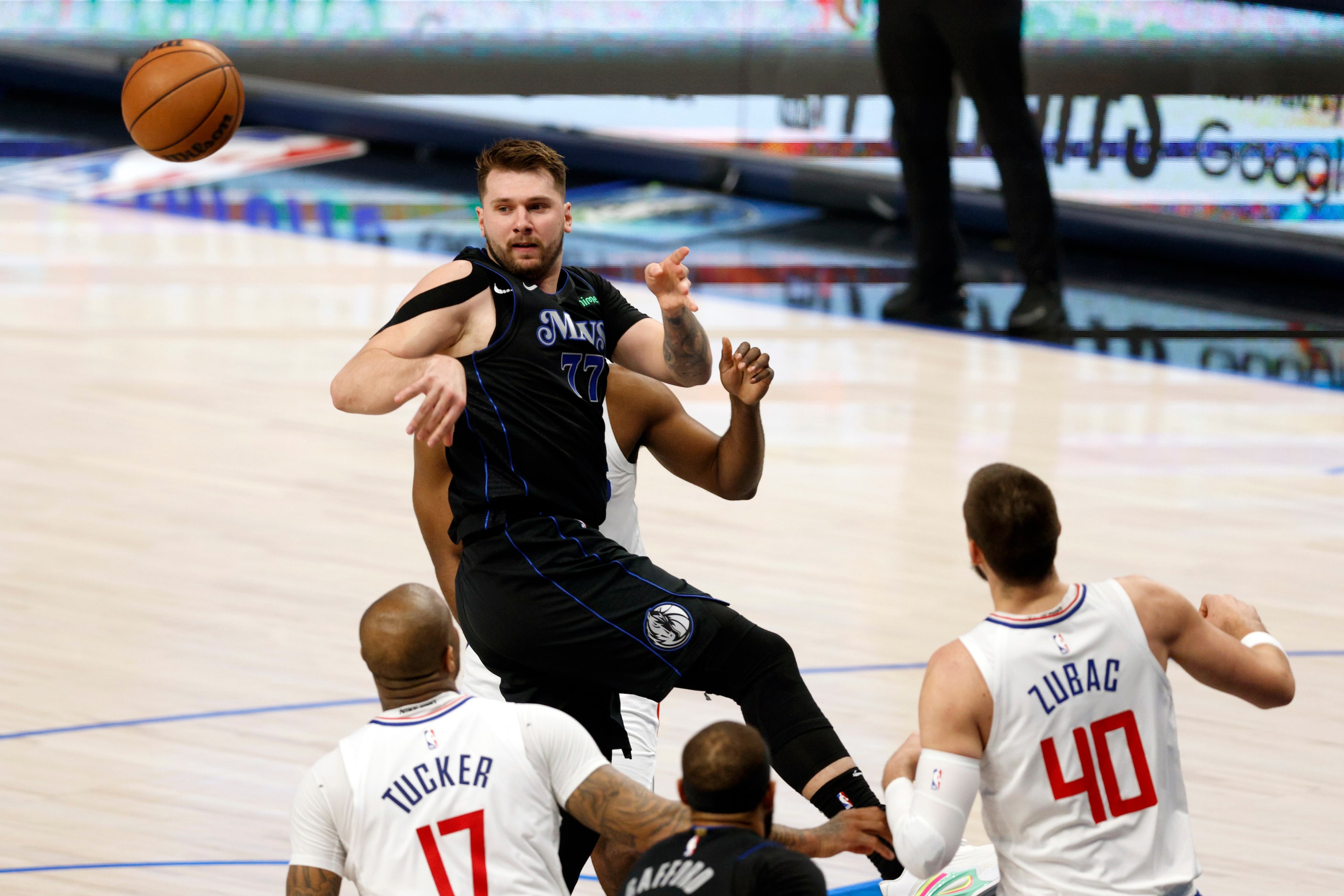 Dallas Mavericks guard Luka Doncic (77) passes away from LA Clippers forward P.J. Tucker...