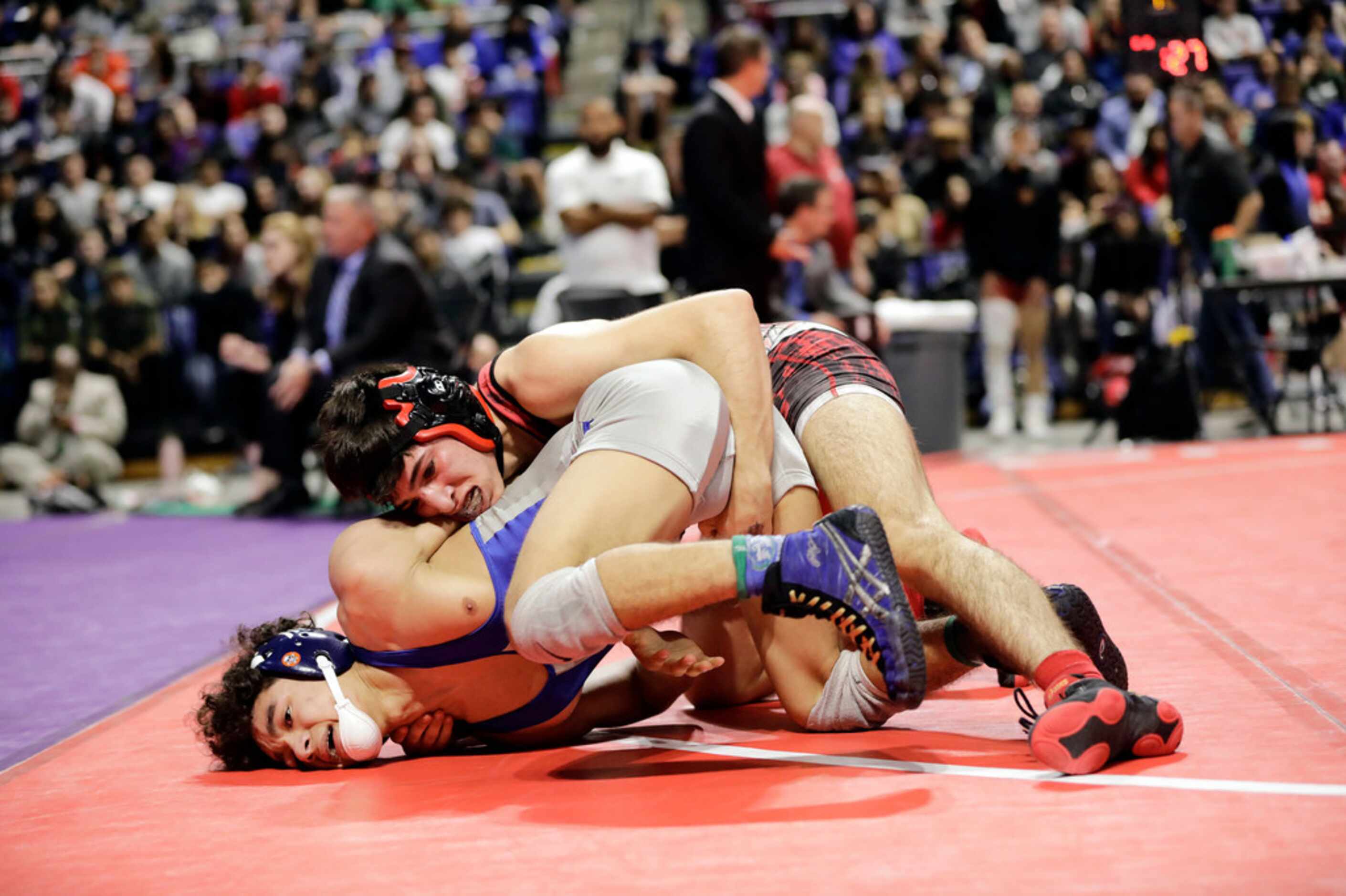 Dominic Chavez of Arlington Martin wrestles during the UIL Texas State Wrestling...