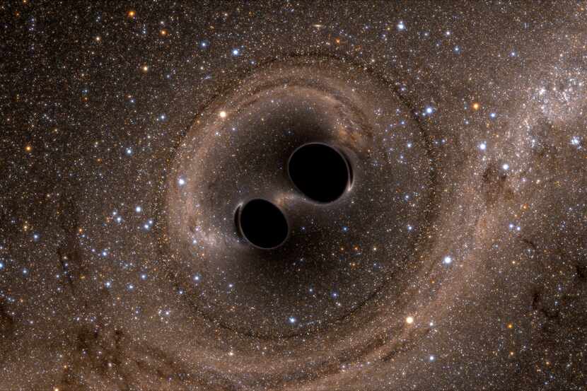 A handout image of an artistÕs rendering of the collision of two black holes. Scientists say...