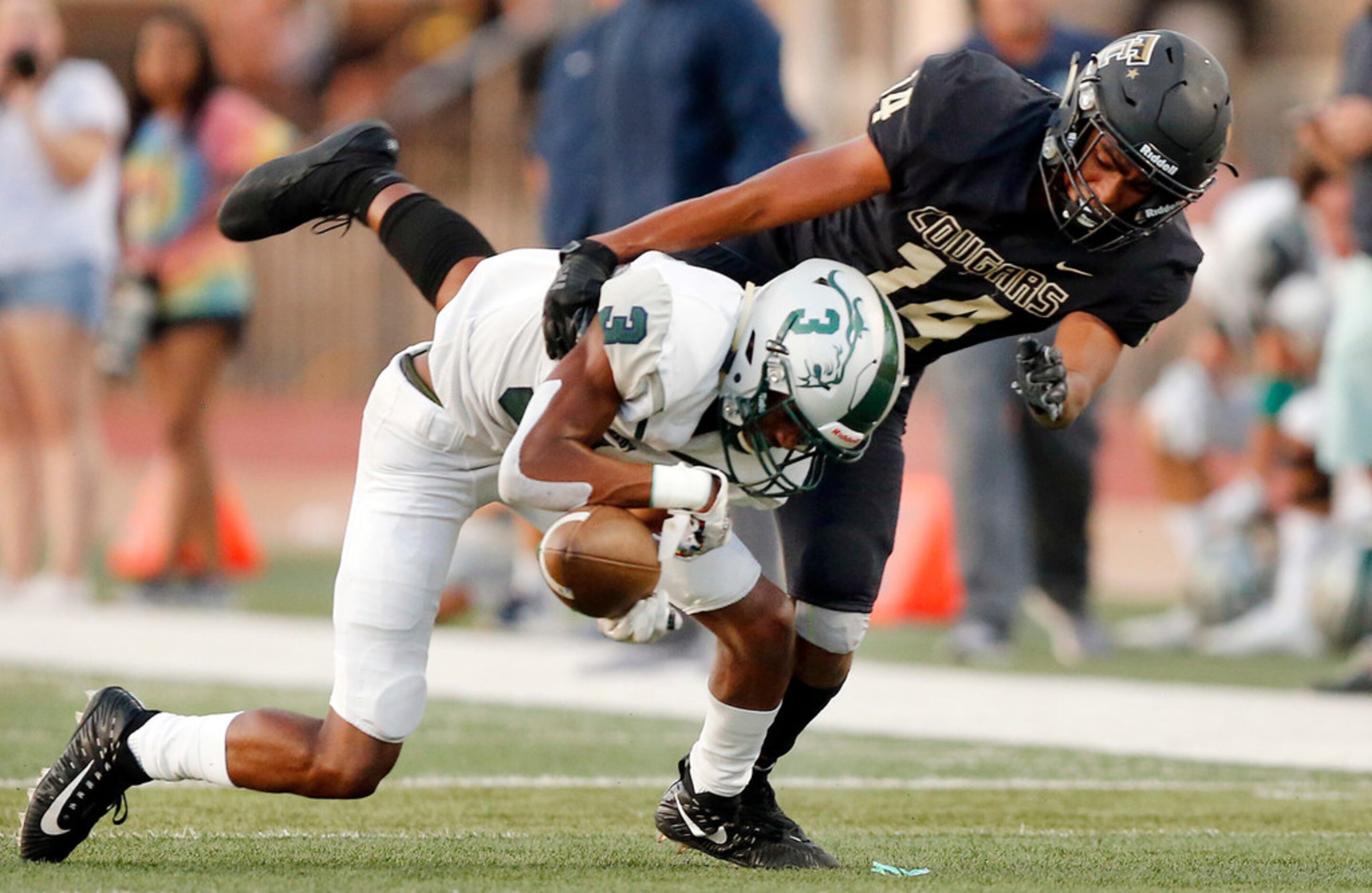 The Colony cornerback Stephen Wallak (14) breaks up a first quarter pass attempt to Frisco...