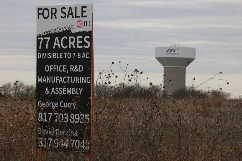 A sign posted in the field proposed to become a film studio development in Mansfield.