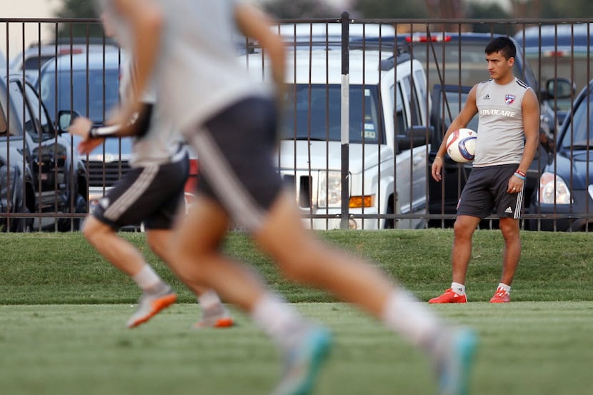 FC Dallas midfielder Mauro Diaz watches practice from the sideline on Thursday, Aug. 27,...