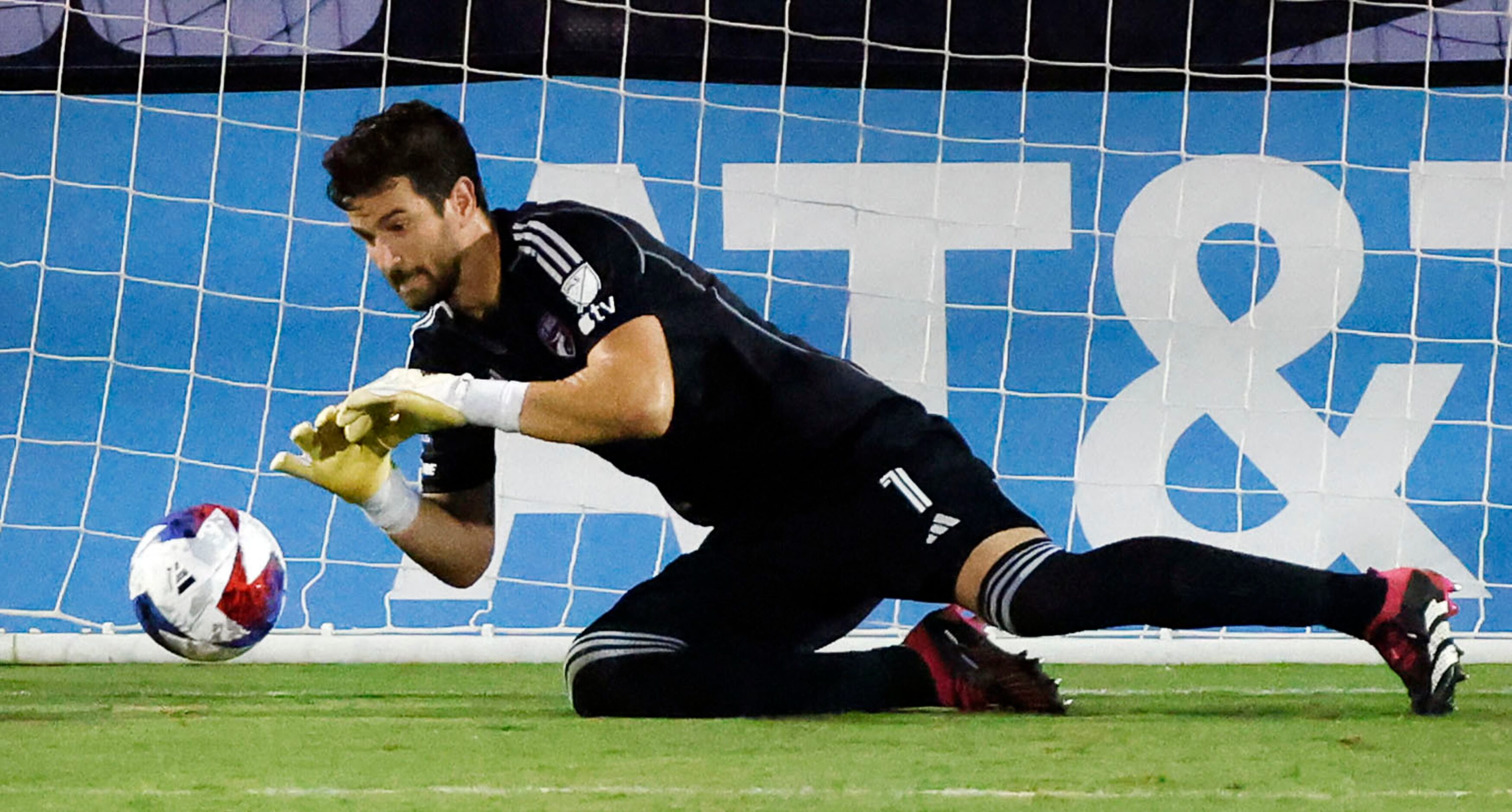 FC Dallas goalkeeper Jimmy Maurer (1) dives for a Charlotte FC shot during the first half of...