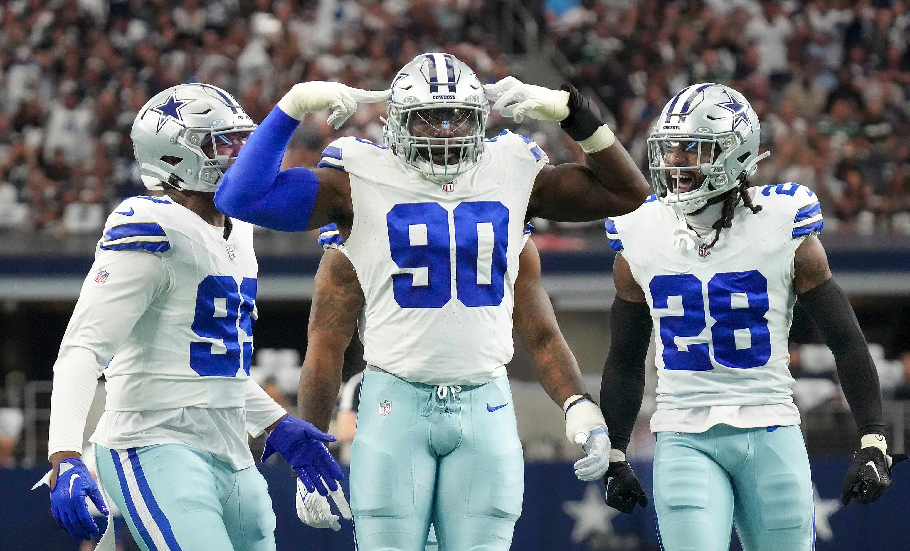 Dallas Cowboys defensive end DeMarcus Lawrence (90) celebrates after a defensive stop during...