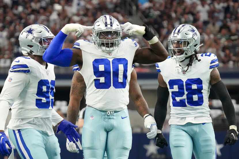 Dallas Cowboys defensive end DeMarcus Lawrence (90) celebrates after a defensive stop during...