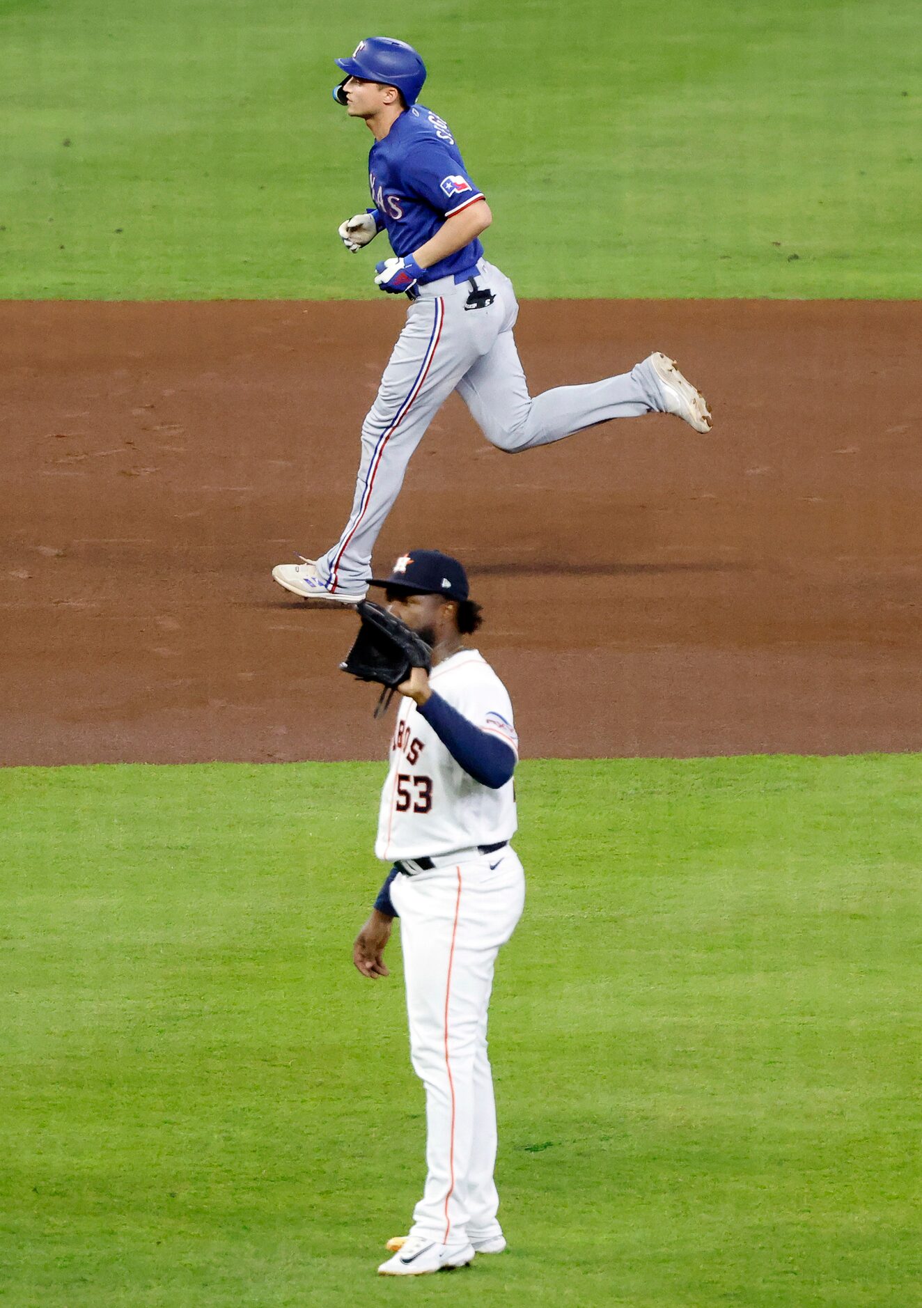 Texas Rangers shortstop Corey Seager (5) circles the bases after hitting a first inning home...