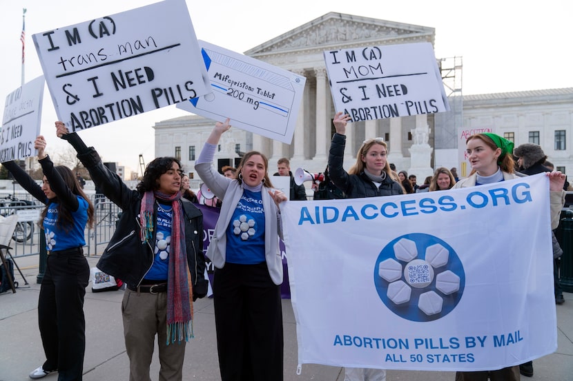 Abortion-rights activists rally outside of the Supreme Court, Tuesday, March 26, 2024, in...