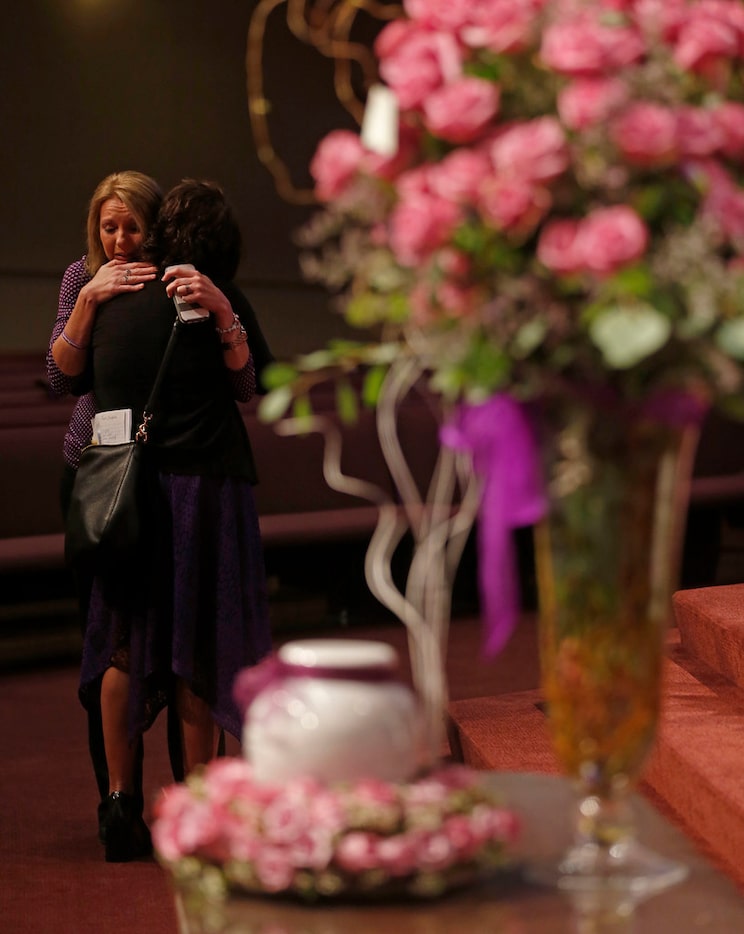 Angel Jenkins, left, of Team Christina hugs Jonni Hare, mother of kidnap victim Christina...