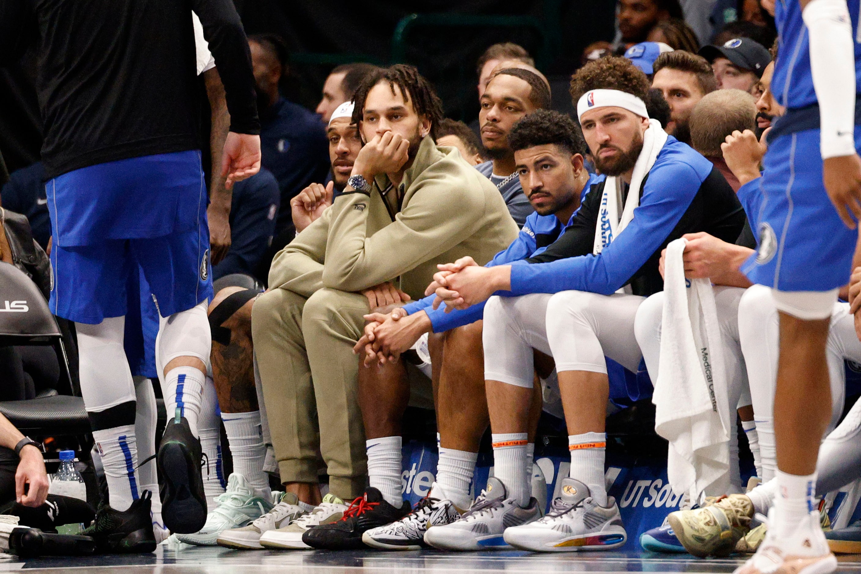 Dallas Mavericks center Dereck Lively II, left, sits on the bench during the second half of...