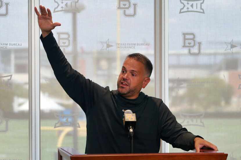 Baylor NCAA college football head coach Matt Rhule gestures as he speaks to the media in...