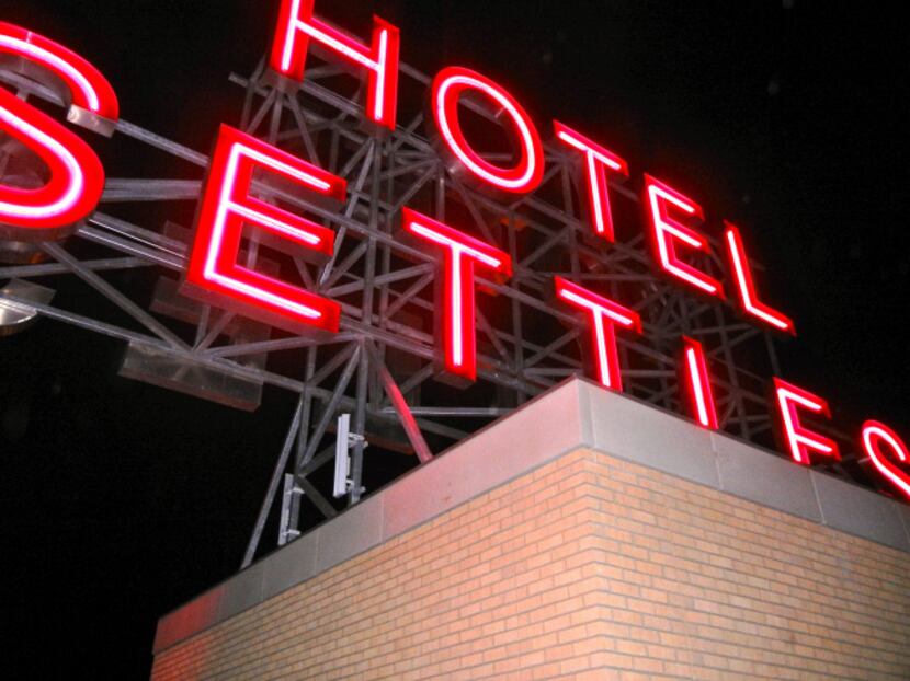 When the Hotel Settles sign was turned on in late December 2012, car horns began honking all...