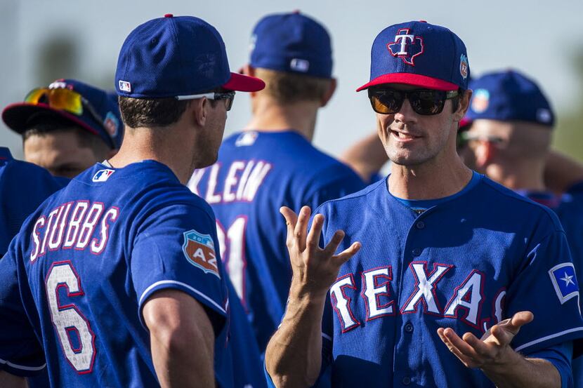 Texas Rangers pitcher Cole Hamels chats with Texas Rangers outfielder Drew Stubbs before a...