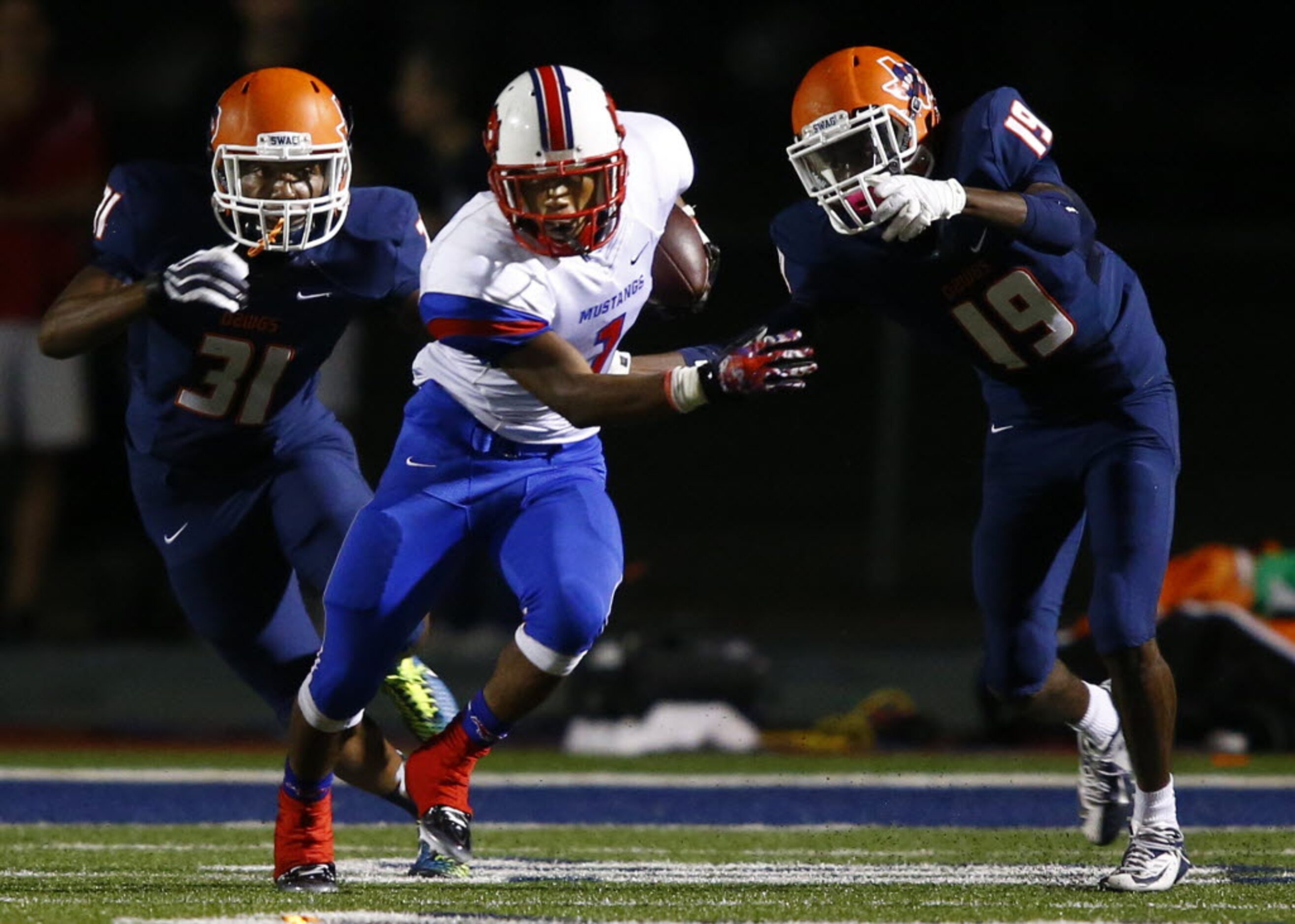 TXHSFB Richardson Pearce running back Otis Blanton (1) carries the ball as McKinney North...