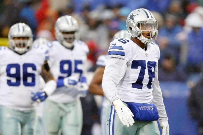 Dallas Cowboys defensive end Greg Hardy (76) looks up before the start of the next play...