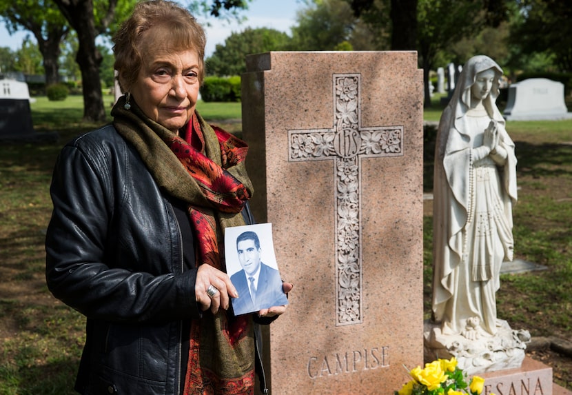 Lucy Campise held an old photo of her husband, Frank Campise, by his grave at Calvary Hill...