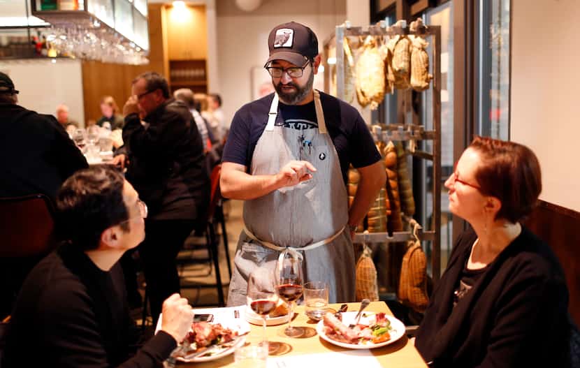 Chef David Uygur talks to diners at Macellaio in 2018.