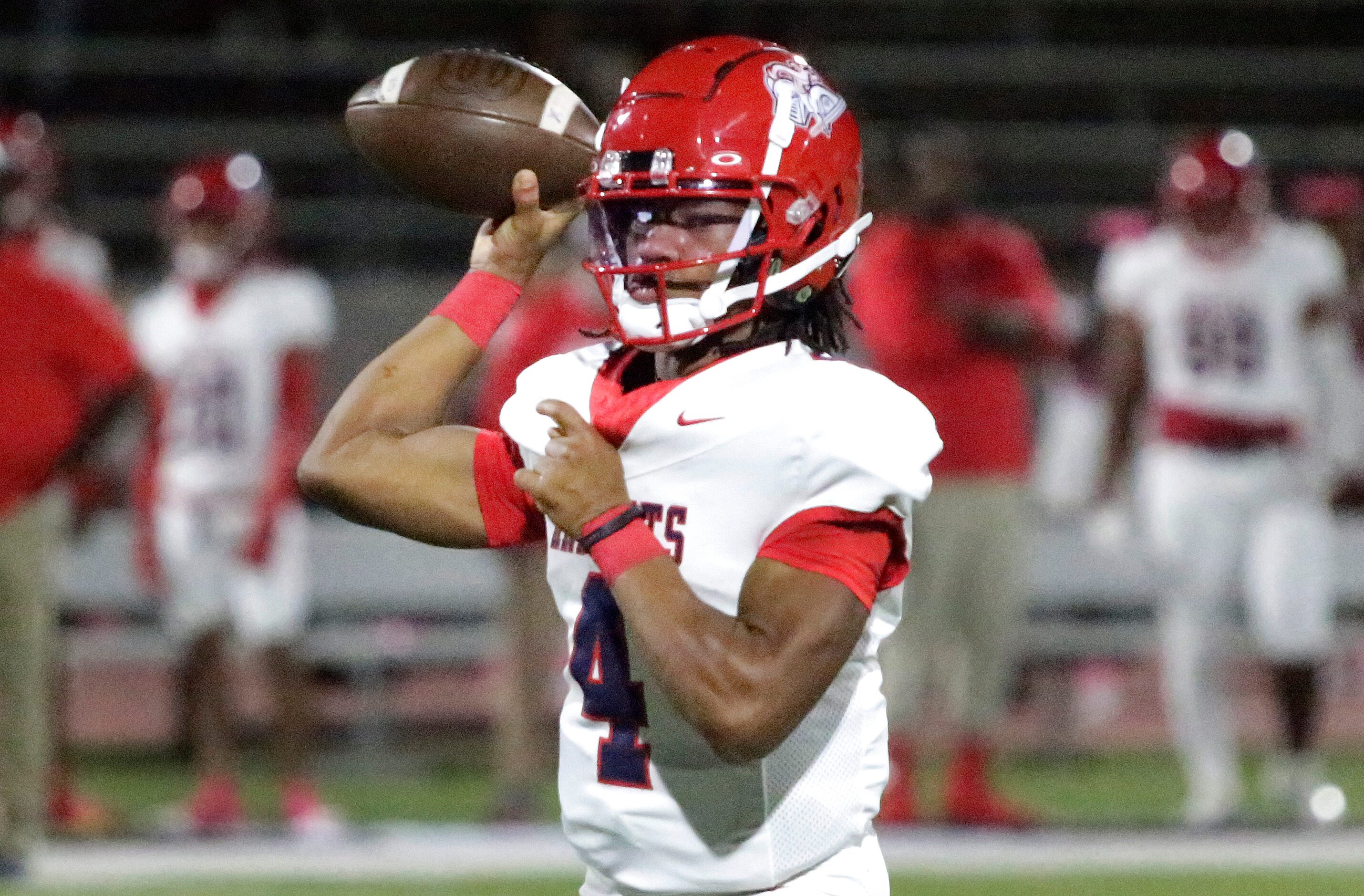 Kimball High School quarterback Armirie Williams-Hall (4) throws a pass during the first...