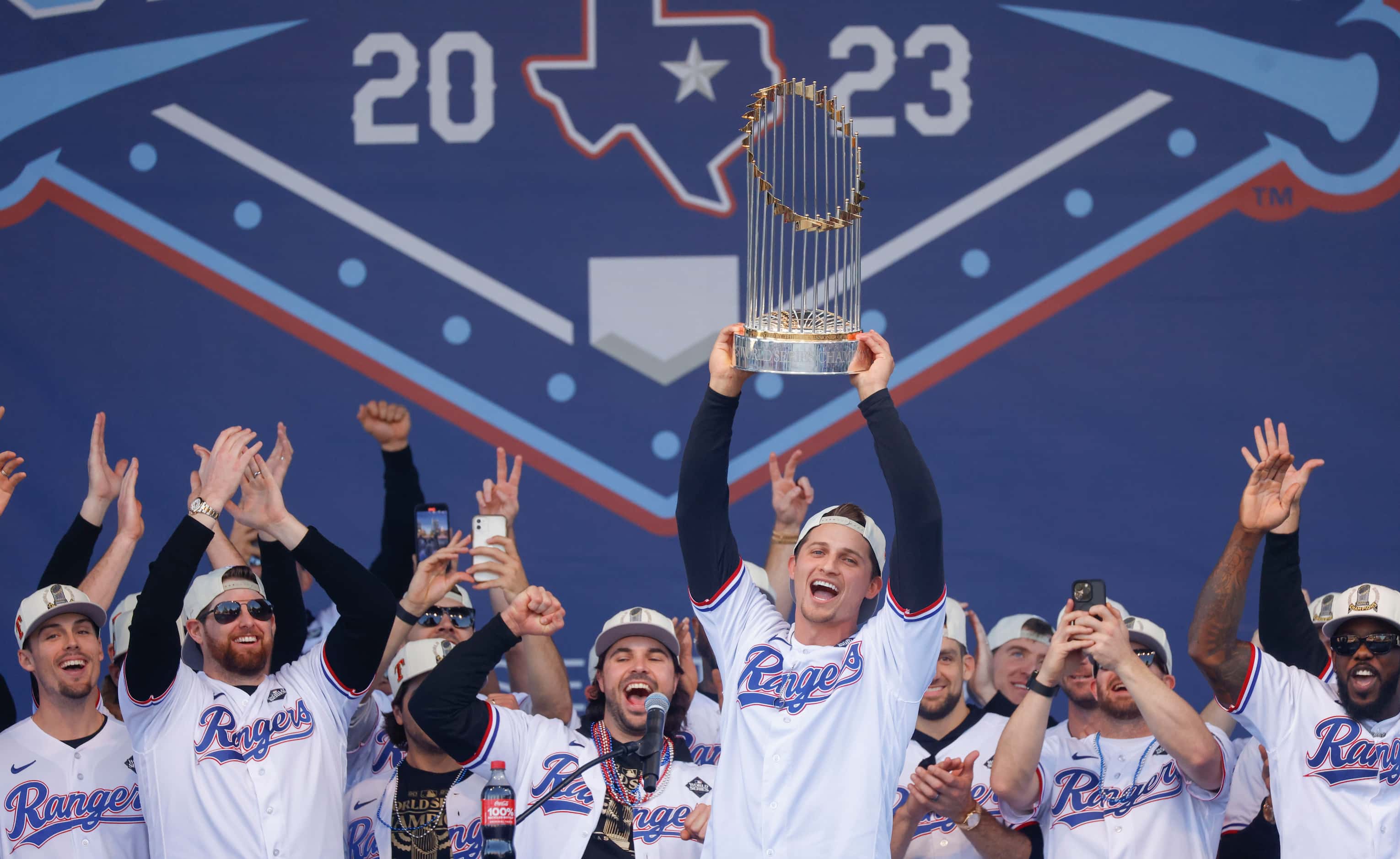 Texas Rangers’ Corey Seager hoists the Commissioner's Trophy during Texas Rangers World...