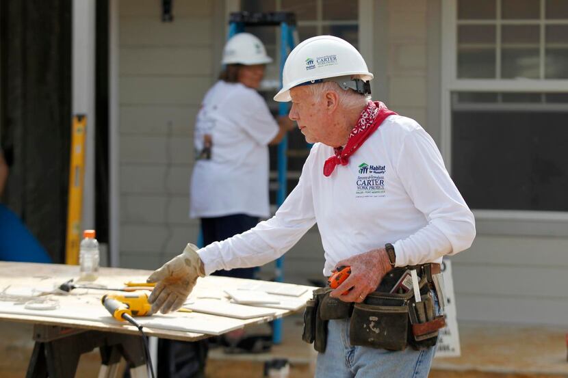 
Former President Jimmy Carter pitched in to help on a house for Habitat for Humanity, near...