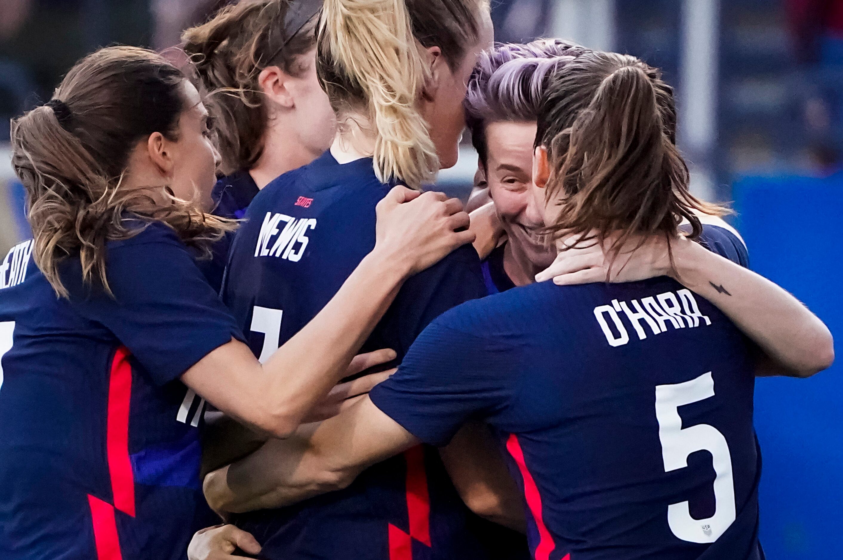 USA forward Megan Rapinoe celebrates with teamates after scoring on a free kick during the...