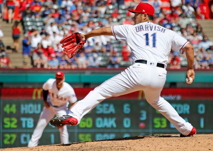 Texas Rangers starting pitcher Yu Darvish (11) throws a sixth-inning pitch during the Kansas...
