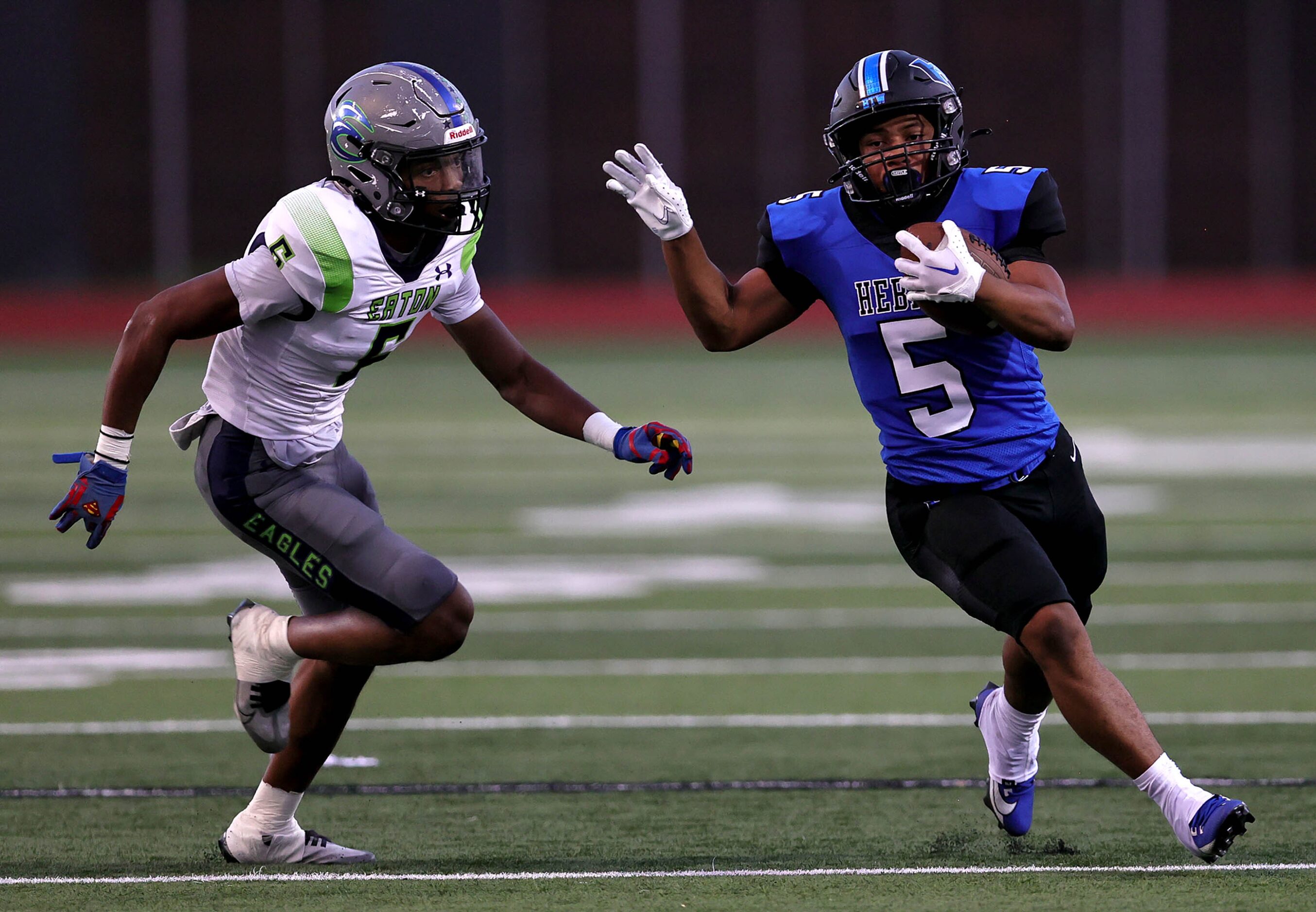 Hebron running back Ayson McCray Jones (5) tries to get around the corner from Eaton...